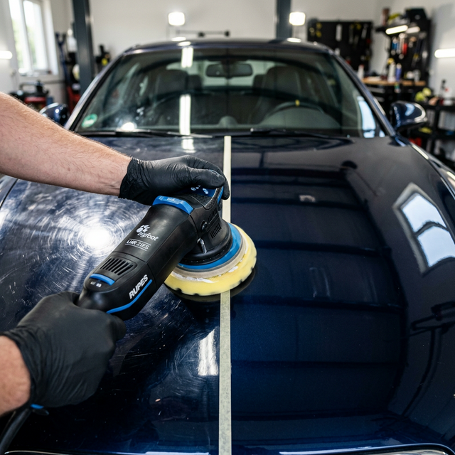 Multi-stage paint correction removing swirl marks and scratches from vehicle clear coat in Tampa